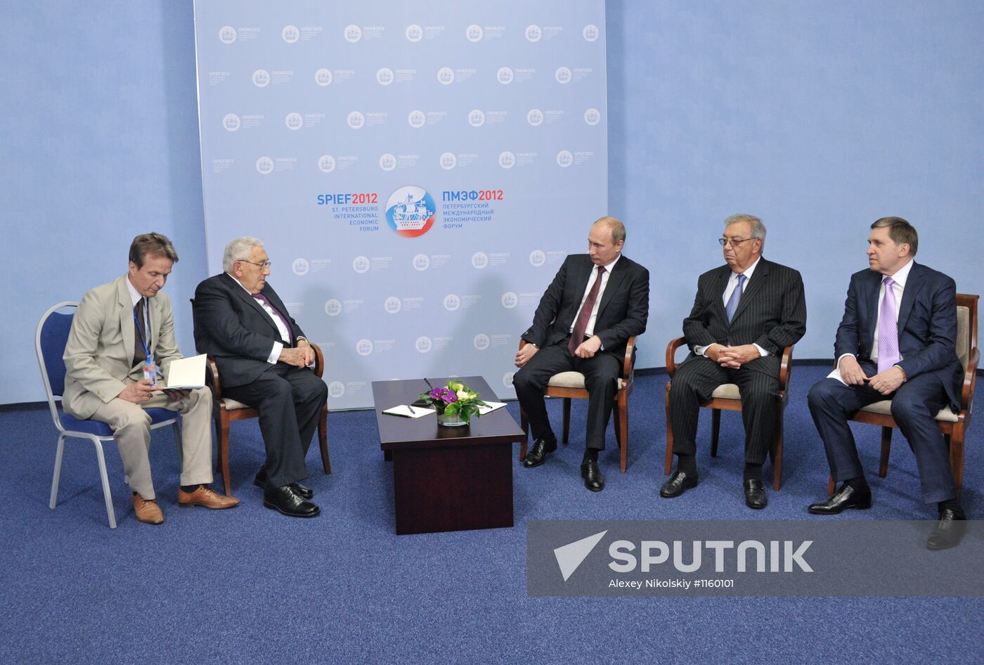 Vladimir Putin meets with Henry Kissinger in St Petersburg