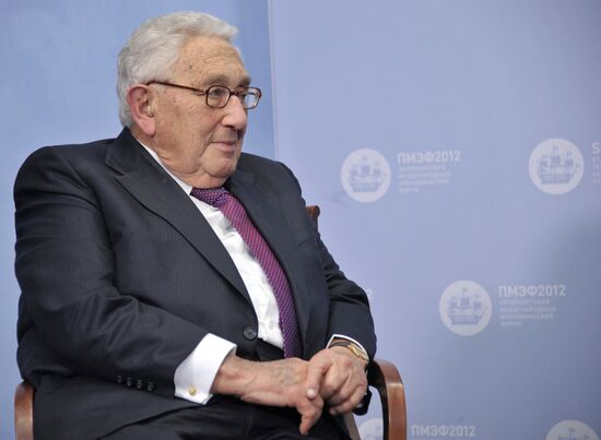 Vladimir Putin meets with Henry Kissinger in St Petersburg