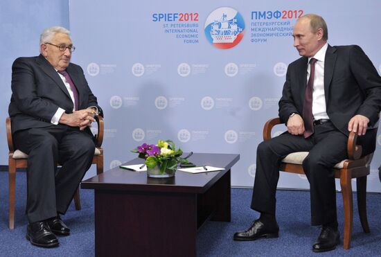 Vladimir Putin meets with Henry Kissinger in St Petersburg