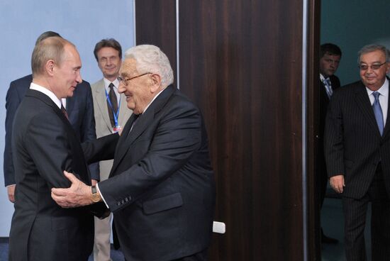 Vladimir Putin meets with Henry Kissinger in St Petersburg