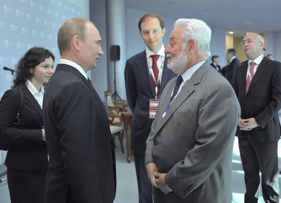 Vladimir Putin meets with Henry Kissinger in St Petersburg