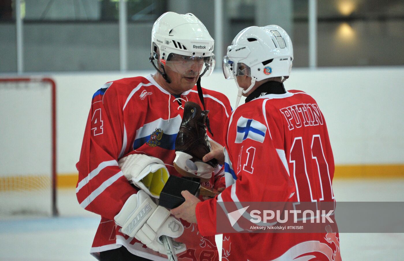 V. Putin and S.Niiniste take part in a friendly hockey match