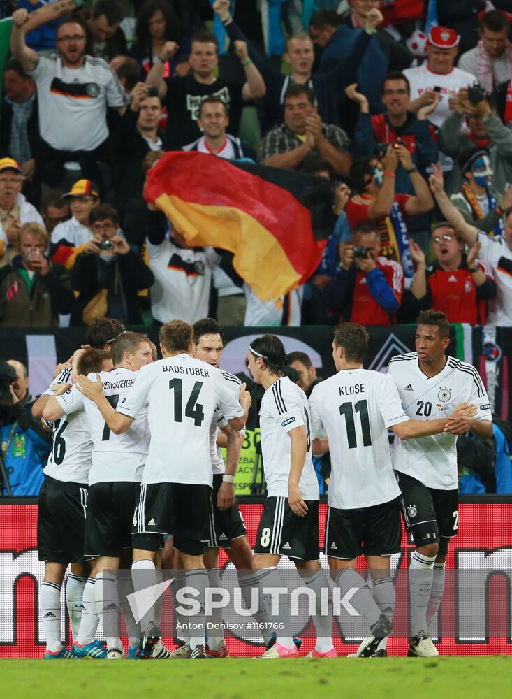 German national team players celebrate scoring a second goal in the quarterfinal match of the European Football Championship between teams of Germany and Greece. Location: Poland, Gdansk. Author: Anton Denisov/Sputnik. UEFA Championship 2012. Germany vs. Greece