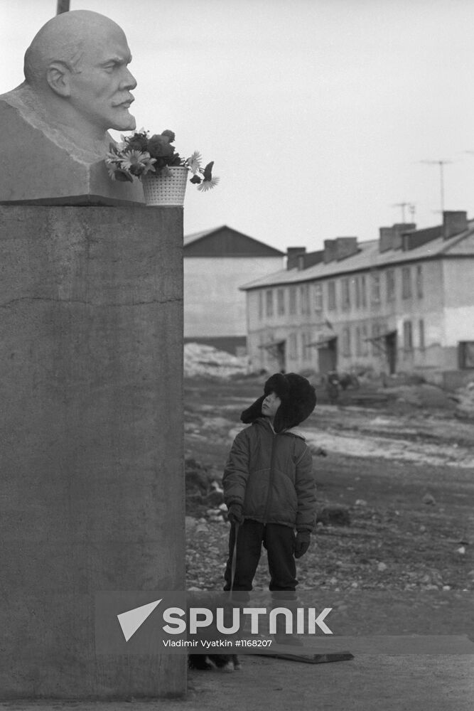 Chukchi boy seen near monument to Vladimir Lenin