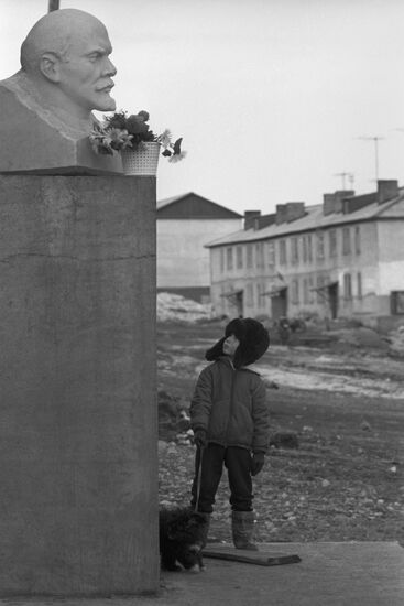 Chukchi boy seen near monument to Vladimir Lenin