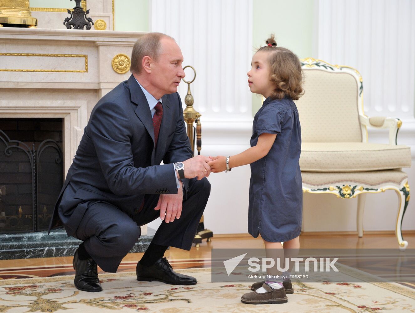 Vladimir Putin meets with girl who was given heart transplant