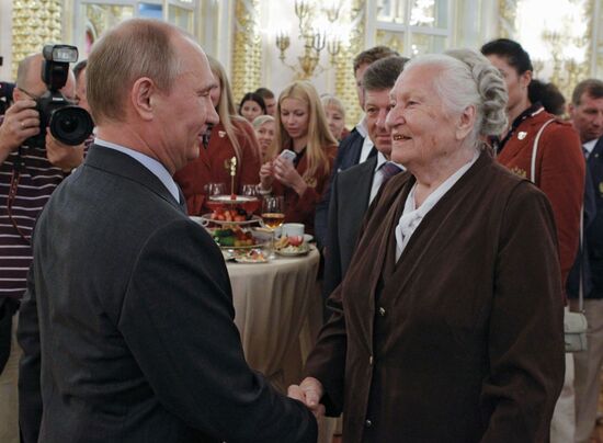 Vladimir Putin meets with Russian Olympic team