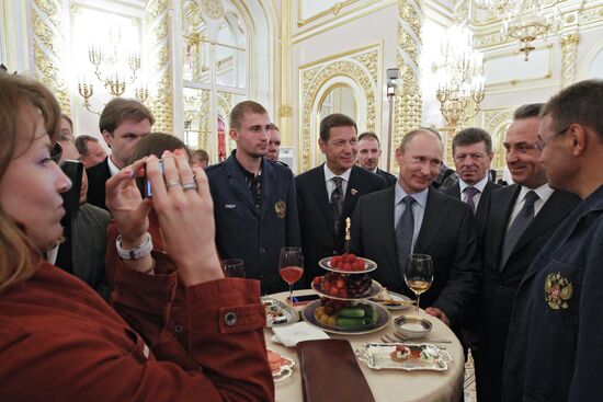 Vladimir Putin meets with Russian Olympic team