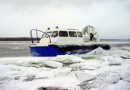 FROZEN RIVER CROSSING IN SPRING THAW