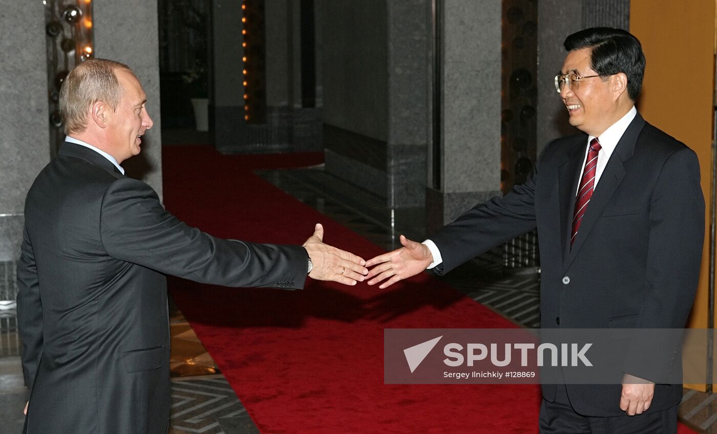 V. PUTIN AND HU JINTAO