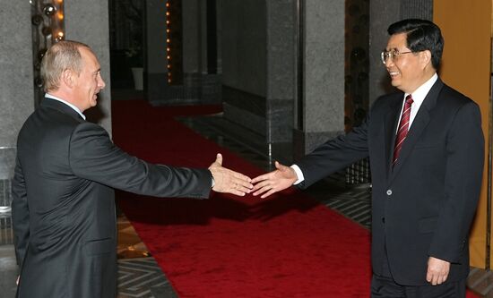 V. PUTIN AND HU JINTAO