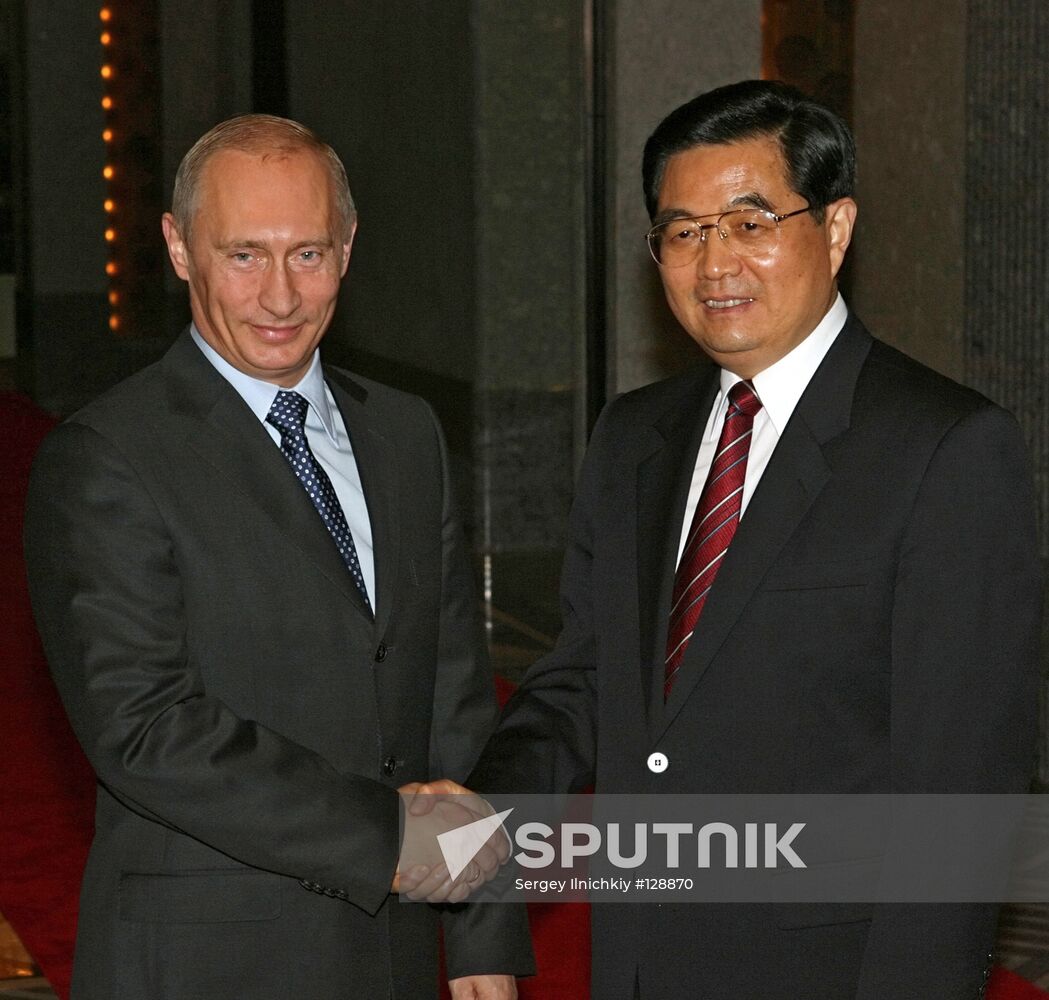 V. PUTIN AND HU JINTAO