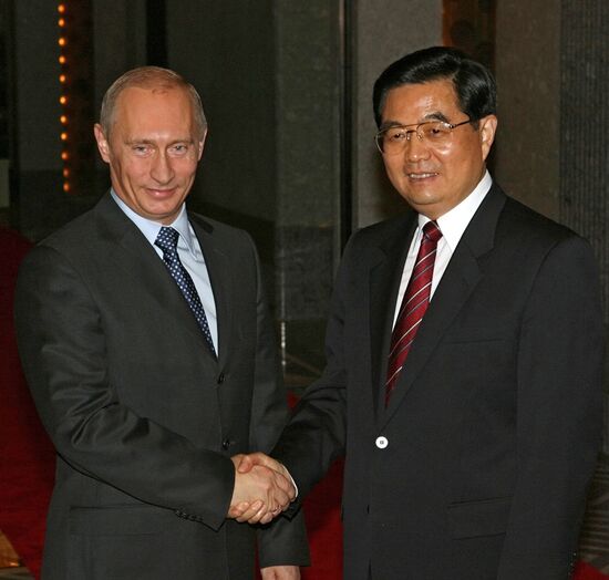 V. PUTIN AND HU JINTAO