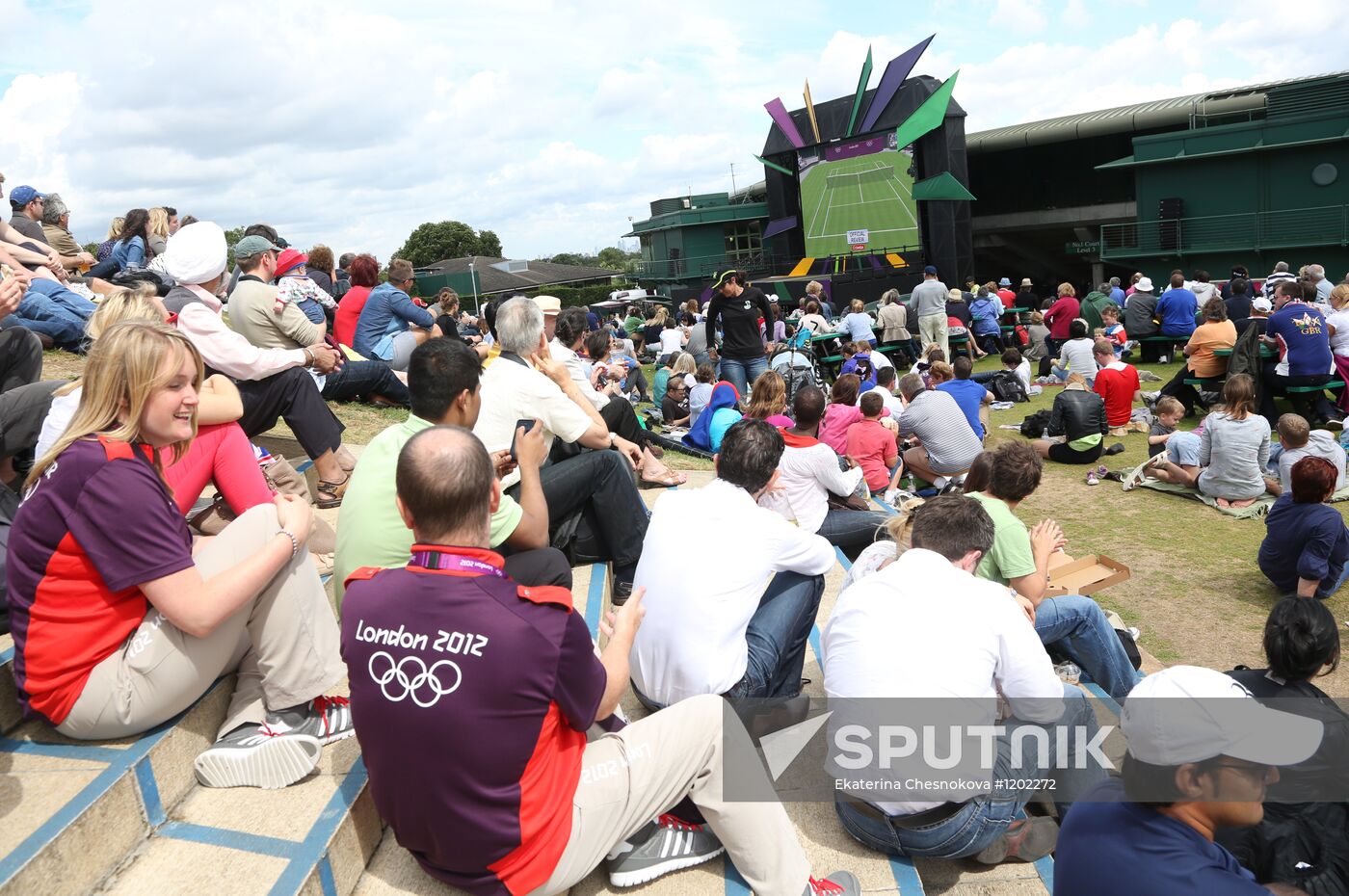 Viewers watch tennis match's broadcast at Wimbledon Stadium