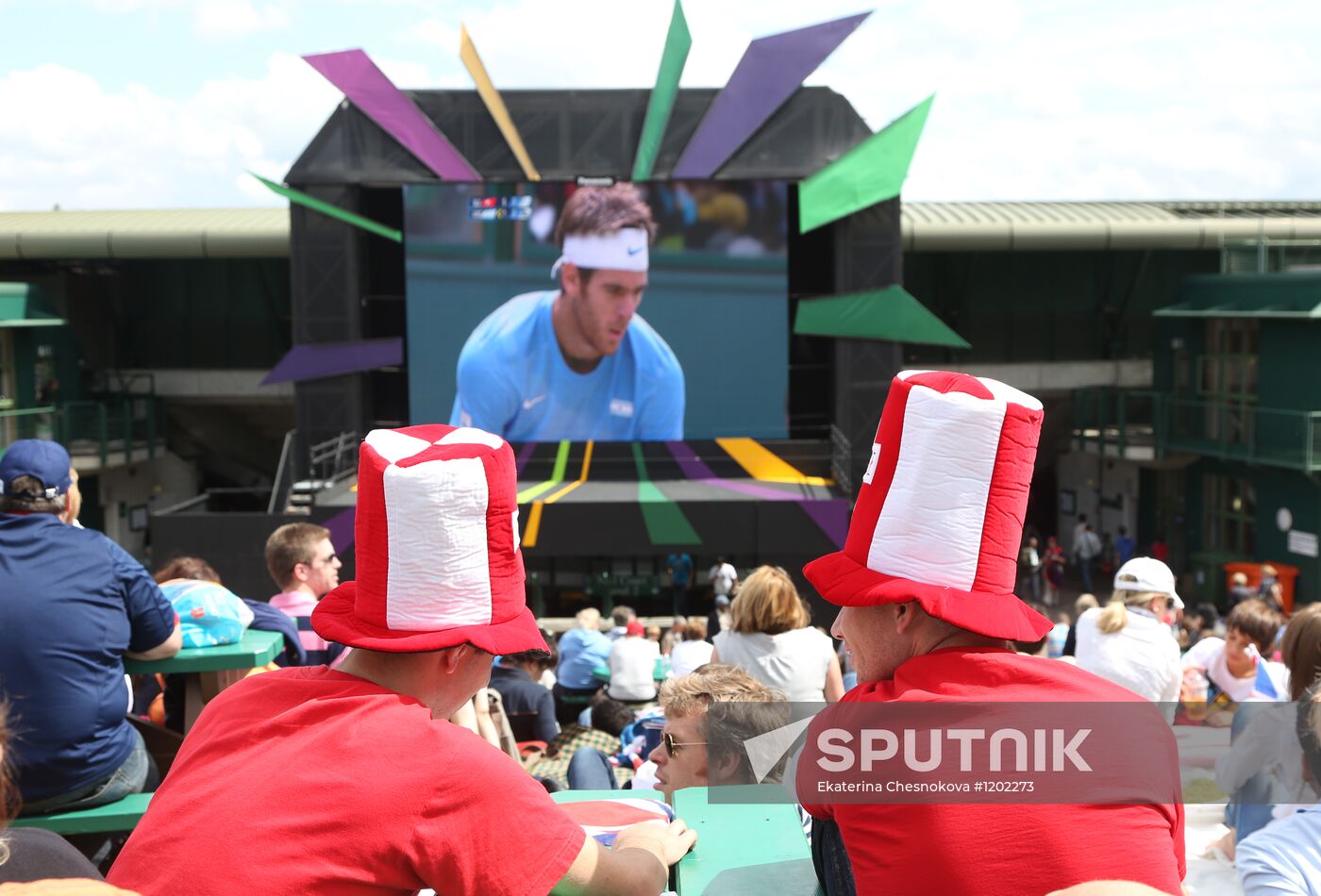 Viewers watch tennis match's broadcast at Wimbledon Stadium