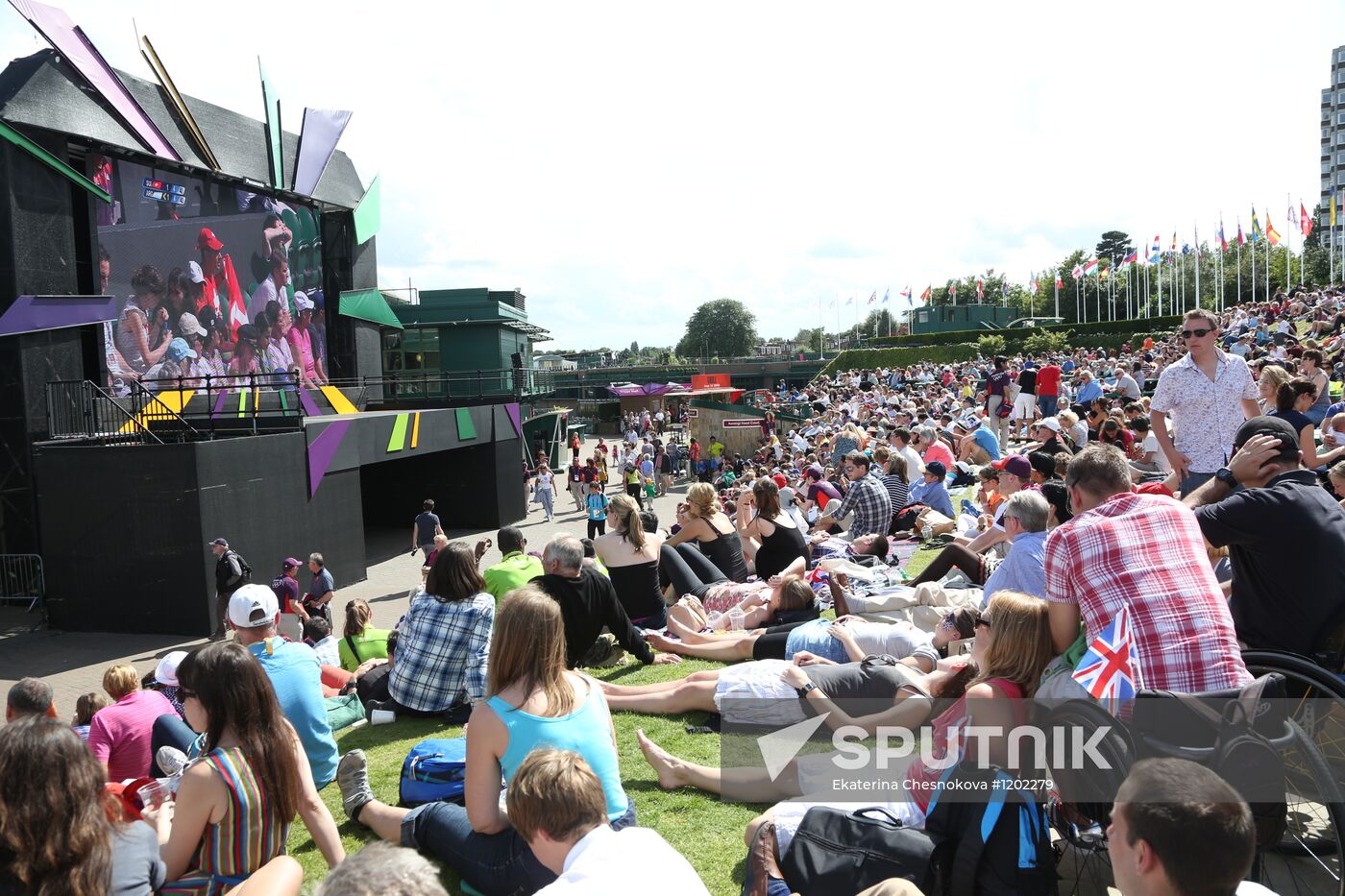 Viewers watch tennis match's broadcast at Wimbledon Stadium