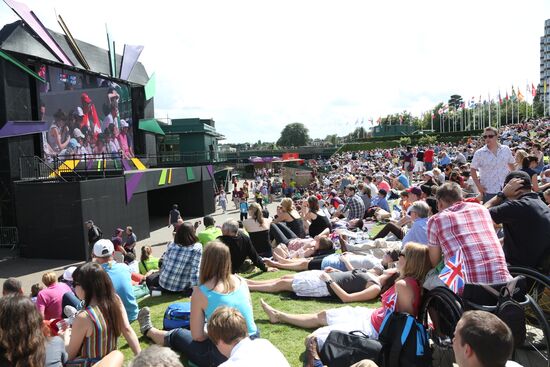 Viewers watch tennis match's broadcast at Wimbledon Stadium