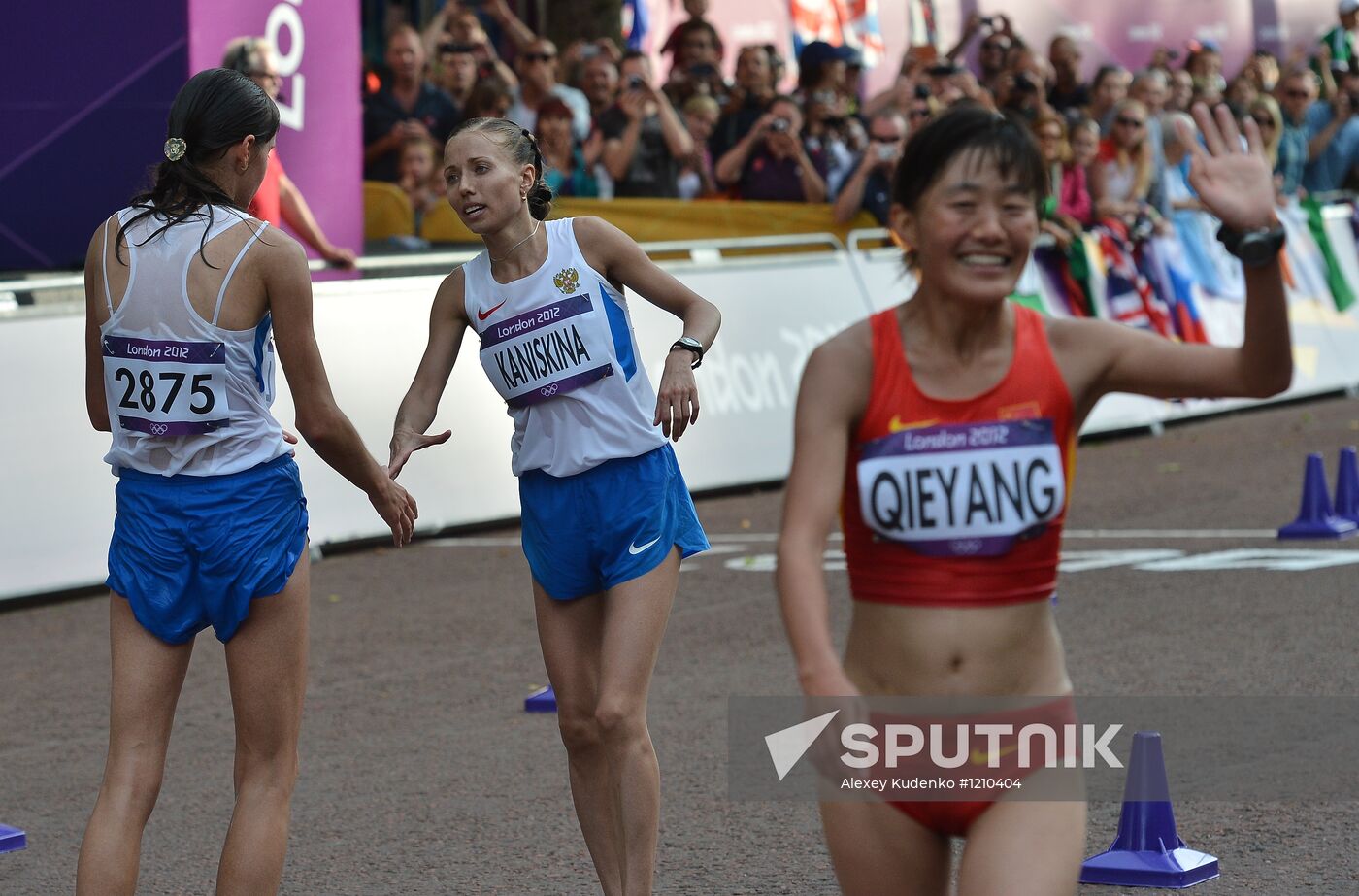 From left: Russia's Yelena Lashmanova, gold medalist, and Olga Kaniskina, silver medalist, after finishing the final women's 20-kilometer race walk at the 30th Summer Olympic Games in London. Location: United Kingdom, London. Author: Alexey Kudenko/Sputnik. 2012 Olympics. Athletics. Women's 20 km race walk