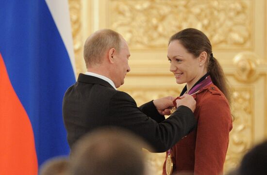 Vladimir Putin presents state awards to Russian Olympic athletes