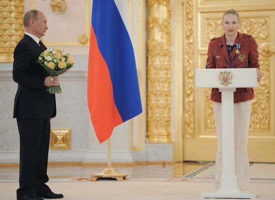 Vladimir Putin presents state awards to Russian Olympic athletes