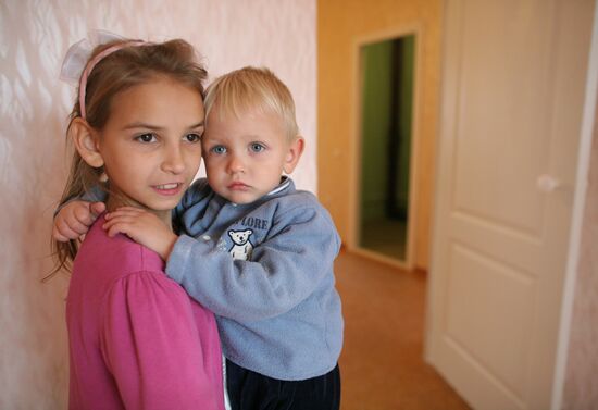 Large family take up residence in new flat