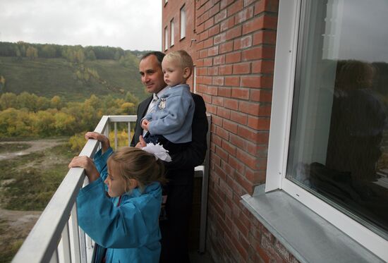 Large family take up residence in new flat