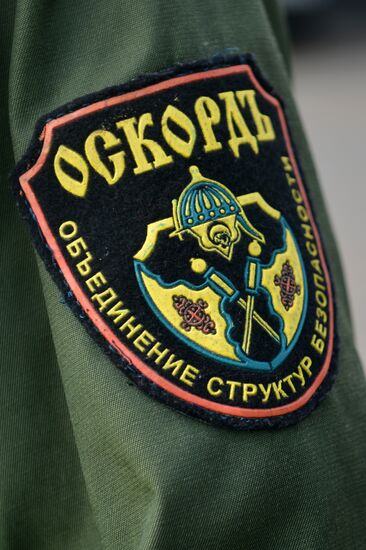 Emblem on uniform of security guard Gennady Gudkov