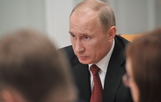 Vladimir Putin conducts a video conference