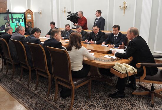 Vladimir Putin conducts a video conference