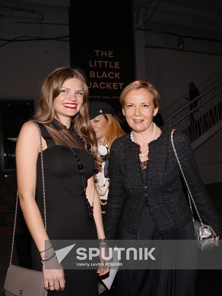 Tatyana Torchilina, Director of Cartier's flagship boutique, with her daughter Daria, left, at The Little Black Jacket: Chanel's Classic Revisited exhibition by Karl Lagerfeld and Carine Roitfeld at the Artplay design center. Location: Russia, Moscow. Author: Valeriy Levitin/Sputnik. The Little Black Jacket exhibition opens
