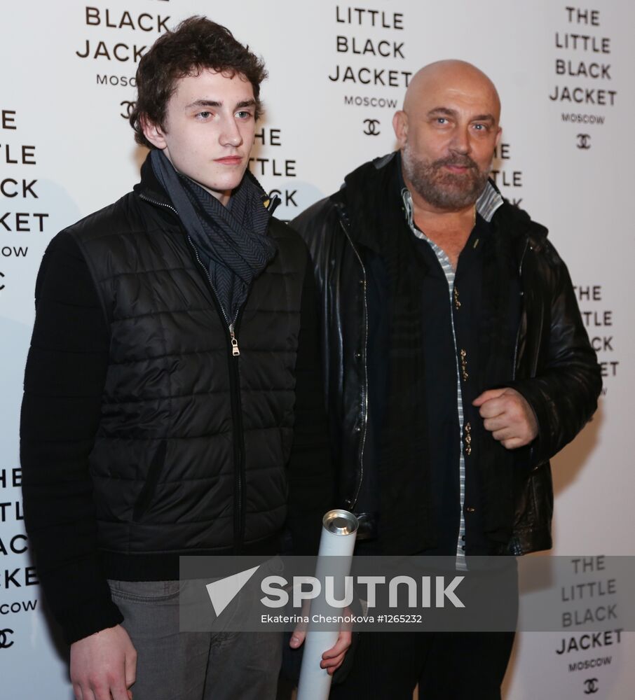 Artist and stage producer Pavel Kaplevich with his son at The Little Black Jacket: Chanel's Classic Revisited exhibition by Karl Lagerfeld and Carine Roitfeld at the Artplay design center. Location: Russia, Moscow. Author: Ekaterina Chesnokova/Sputnik. The Little Black Jacket exhibition opens