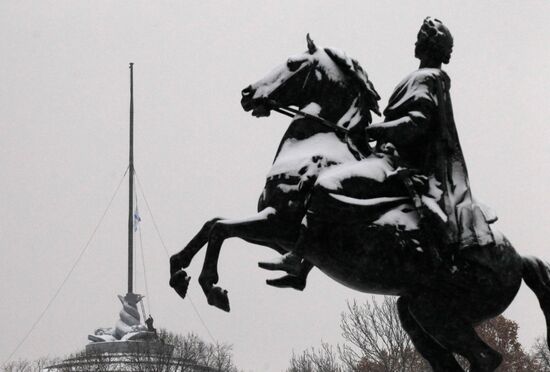 Raising Andreevsky flag in spire of Admiralty in St. Peterburg