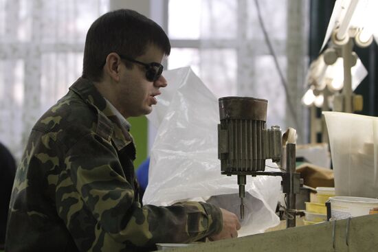 Visually impaired people work at Elekt factory in Vitebsk