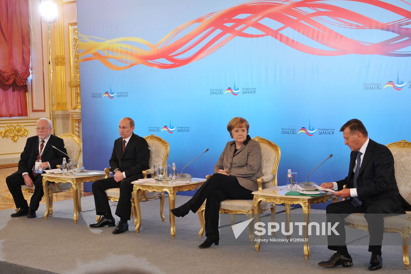 Vladimir Putin and Angela Merkel at St. Petersburg Dialog Forum