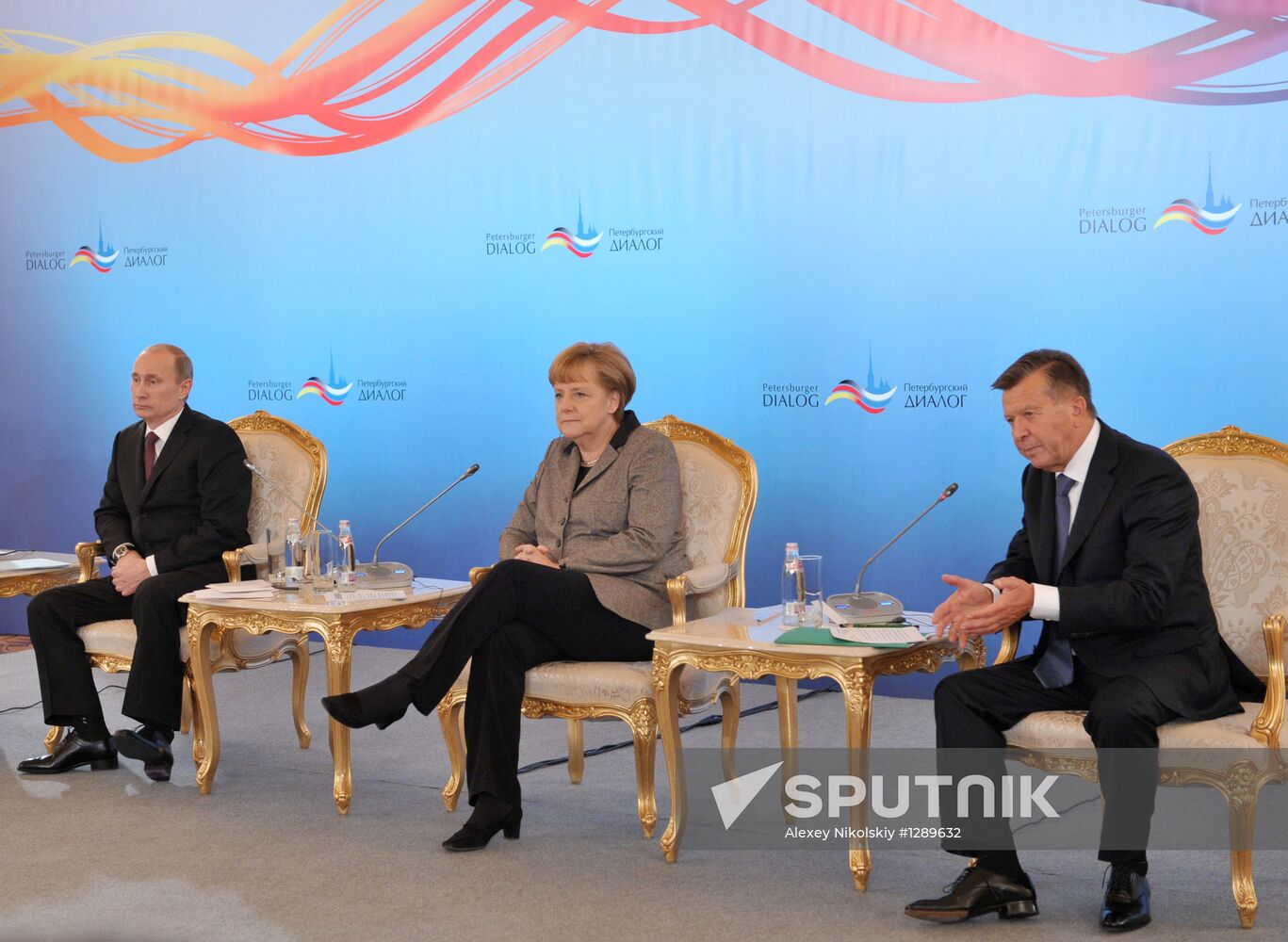Vladimir Putin and Angela Merkel at St. Petersburg Dialog Forum