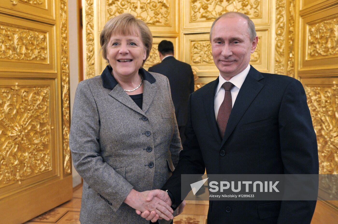 Vladimir Putin and Angela Merkel at St. Petersburg Dialog Forum