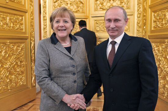 Vladimir Putin and Angela Merkel at St. Petersburg Dialog Forum