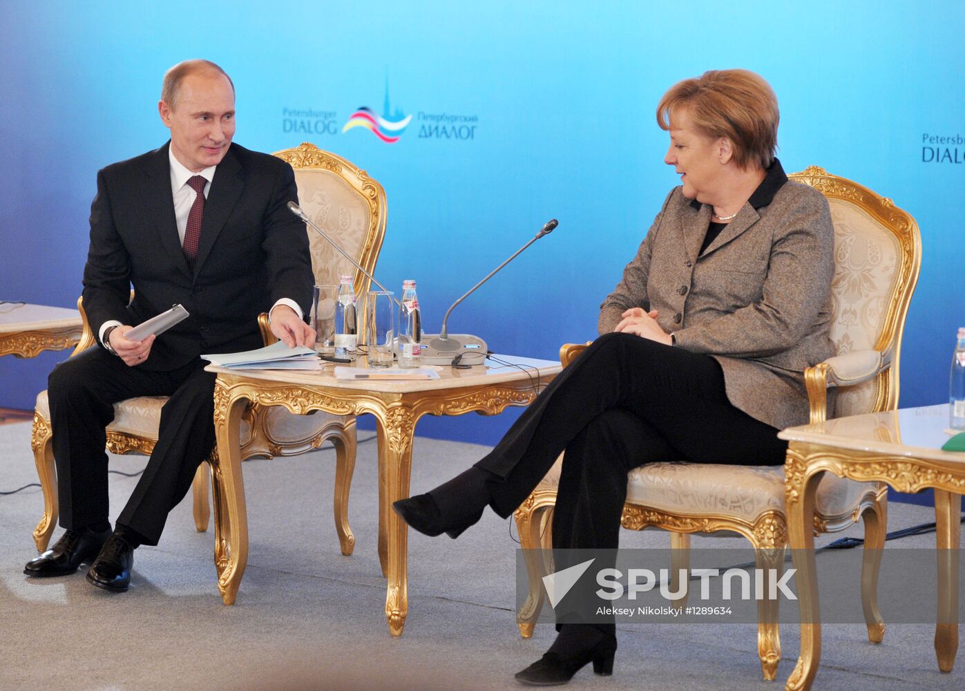 Vladimir Putin and Angela Merkel at St. Petersburg Dialog Forum