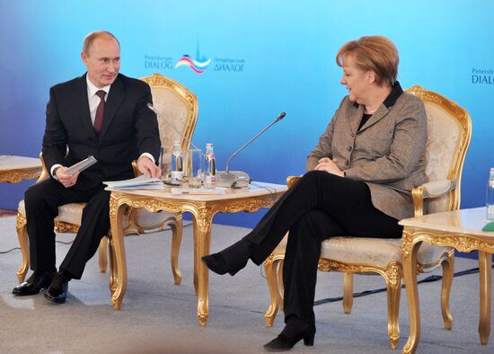 Vladimir Putin and Angela Merkel at St. Petersburg Dialog Forum
