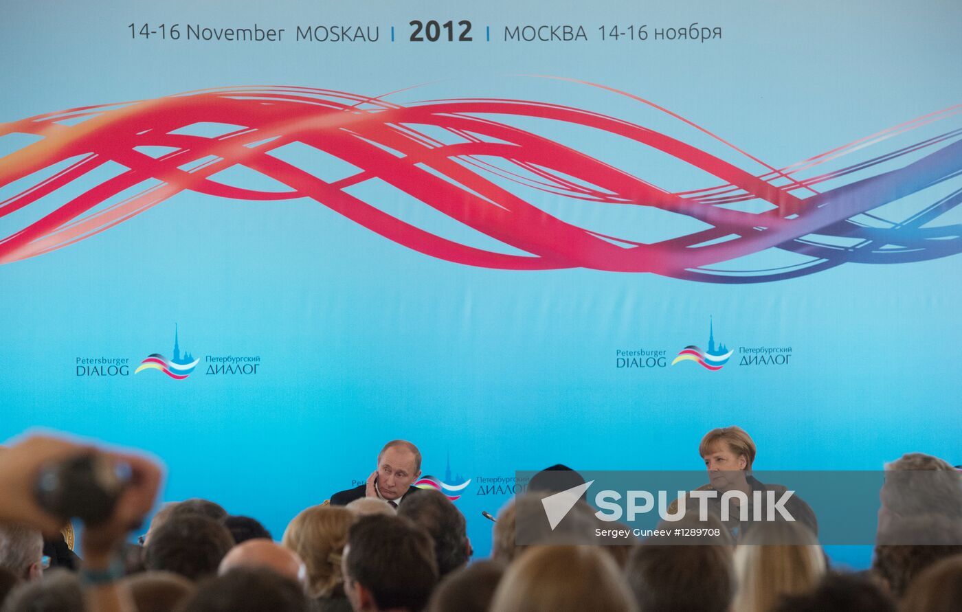 Vladimir Putin and Angela Merkel at 12th Petersburg Dialog