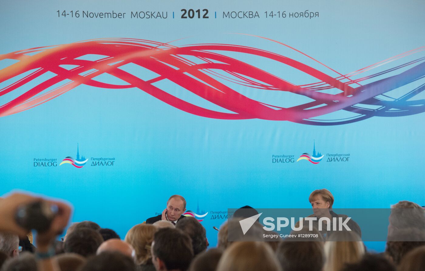 Vladimir Putin and Angela Merkel at 12th Petersburg Dialog
