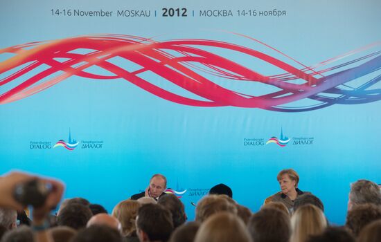 Vladimir Putin and Angela Merkel at 12th Petersburg Dialog