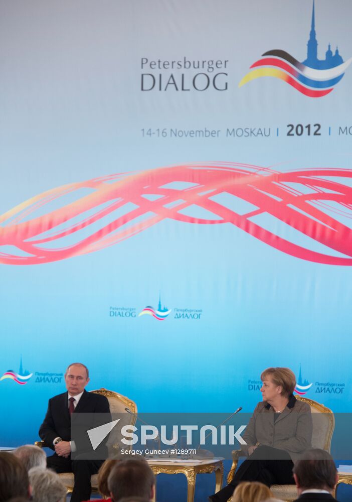 Vladimir Putin and Angela Merkel at 12th Petersburg Dialog