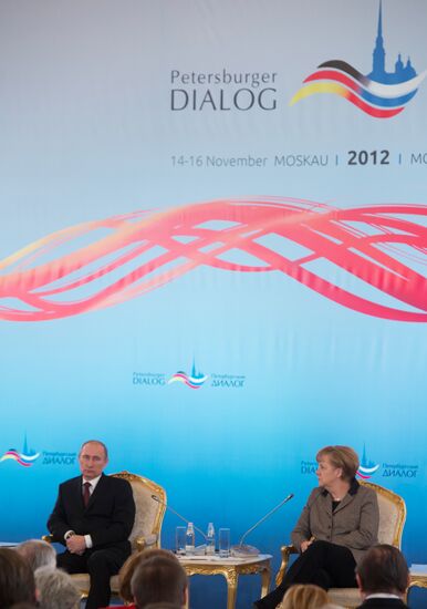 Vladimir Putin and Angela Merkel at 12th Petersburg Dialog
