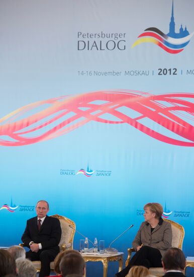 Vladimir Putin and Angela Merkel at 12th Petersburg Dialog