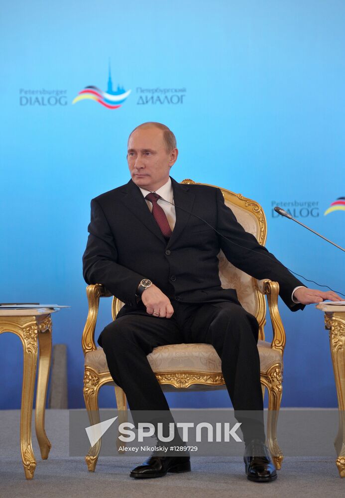 Vladimir Putin and Angela Merkel at 12th Petersburg Dialog