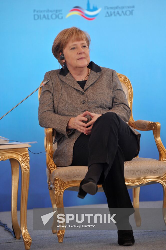 Vladimir Putin and Angela Merkel at 12th Petersburg Dialog