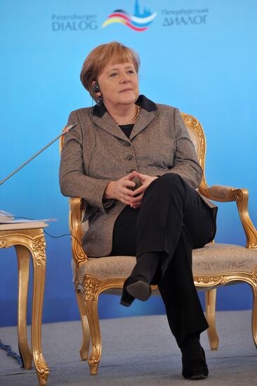Vladimir Putin and Angela Merkel at 12th Petersburg Dialog