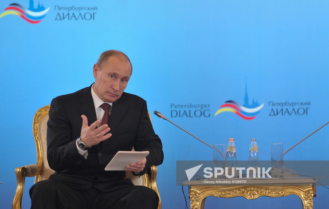 Vladimir Putin and Angela Merkel at St. Petersburg Dialog Forum