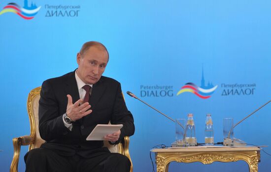 Vladimir Putin and Angela Merkel at St. Petersburg Dialog Forum